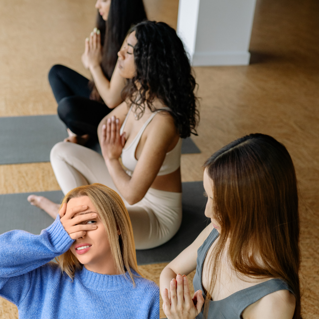 A blonde in a blue sweater awkwardly reacts to a spiritual practice where 3 young women hold yoga poses. The blonde finds herself in the spiritual practice people pleasing trap.