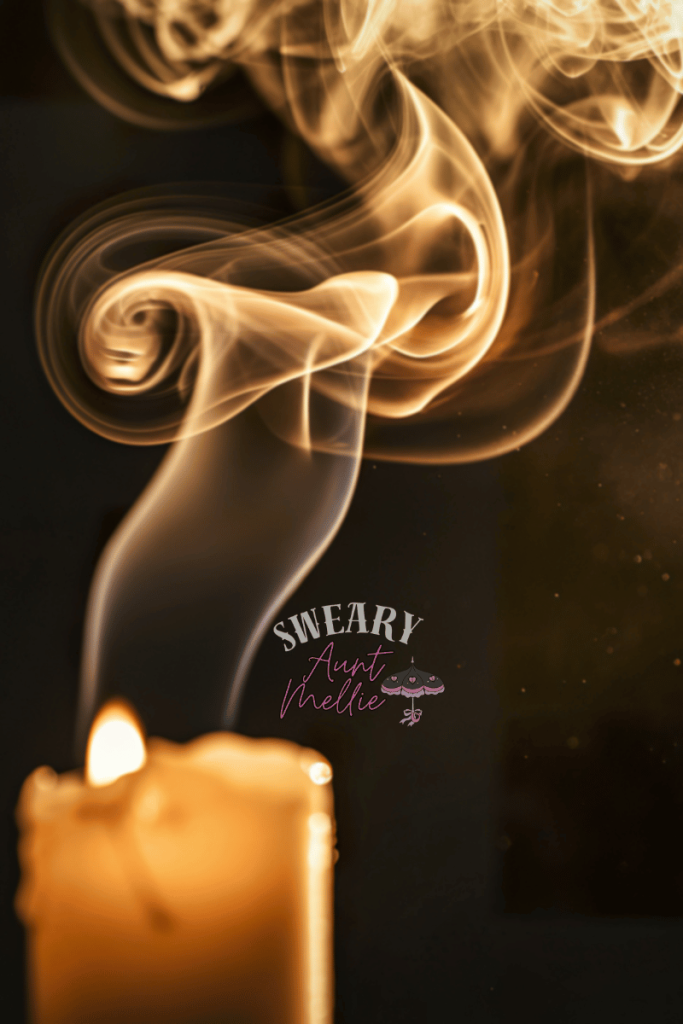 Candle magic spells for beginners require partnering with fire spirits. This picture displays a candle burning brightly and creating a sensory experience with a lot of light, smoke, and of course a candle.